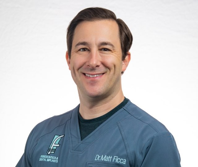 Headshot of Dr. Ficca in medical scrubs